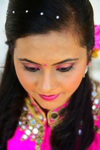 Close-up portrait of a smiling young woman