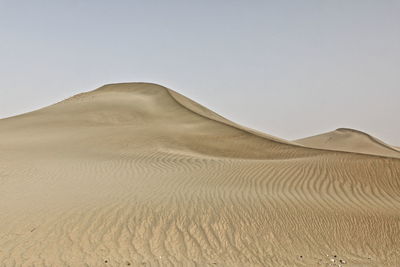 Scenic view of desert against clear sky