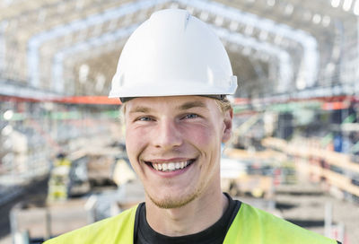 Portrait of happy worker at construction site