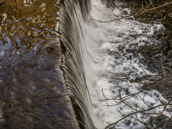 High angle view of waterfall in sea