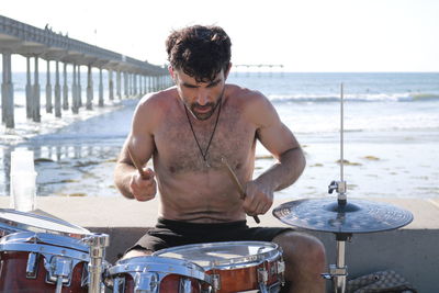 Full length of man playing at beach
