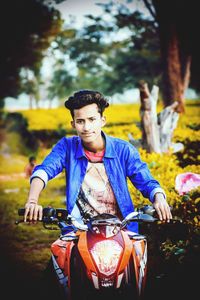 Portrait of young man riding bicycle