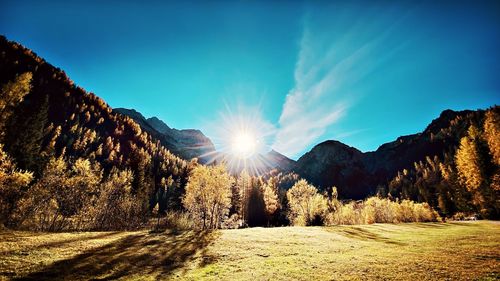 Scenic view of landscape against sky on sunny day