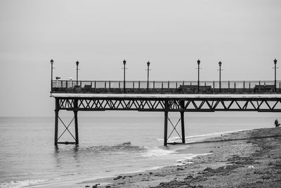 Pier over sea against sky