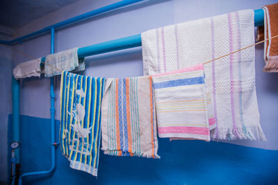 Close-up of towels drying on clothesline