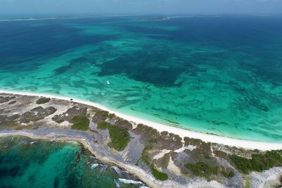 High angle view of beach against blue sky