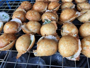 High angle view of breads on metal grate