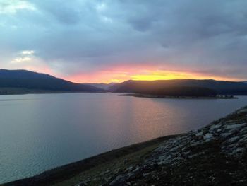 Scenic view of lake against sky during sunset