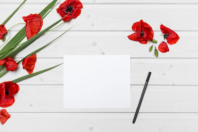 Close-up of red rose on table