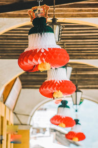 Close-up of red lanterns hanging on ceiling