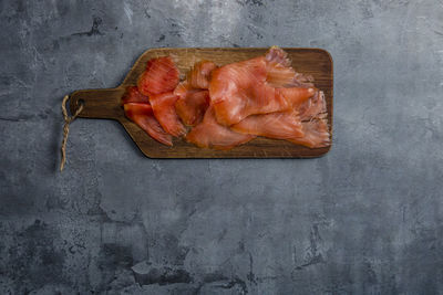 High angle view of meat on cutting board