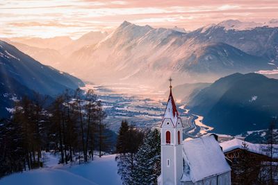 Church against mountains during winter