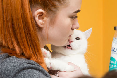 Portrait of woman with cat