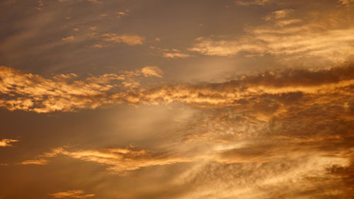 Low angle view of dramatic sky during sunset