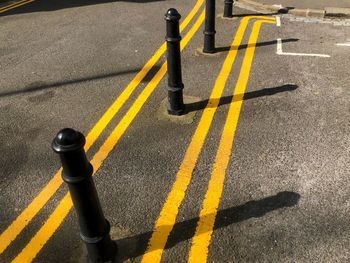 High angle view of yellow crossing sign on road