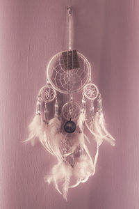 Close-up of illuminated lighting equipment hanging on wall