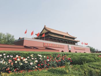 Low angle view of red building against clear sky