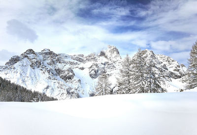 Scenic view of snowcapped mountains against sky