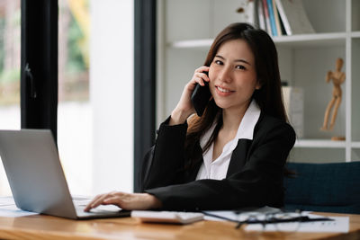 Businesswoman working at table