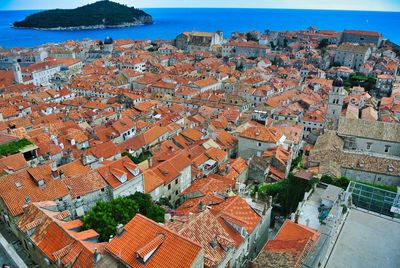 High angle view of townscape by sea