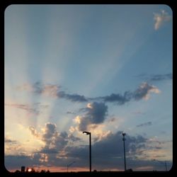 Low angle view of cloudy sky at sunset