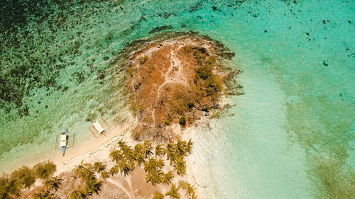Aerial view beautiful beach on a tropical island malcapuya. philippines.