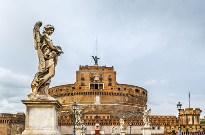 Low angle view of statue against sky