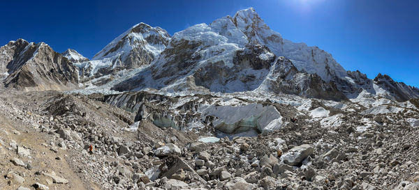 Mountain panorama with big rocks and high snowy mountains in the background