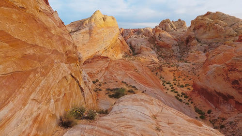 Rock formations on mountain against sky