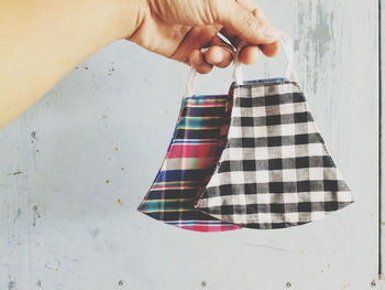 Midsection of woman holding umbrella