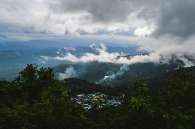 Village in cloud and fog in mountains.