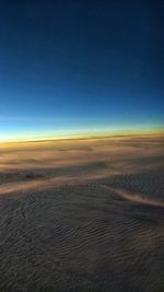 Scenic view of desert against dramatic sky