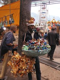 People at market stall in city