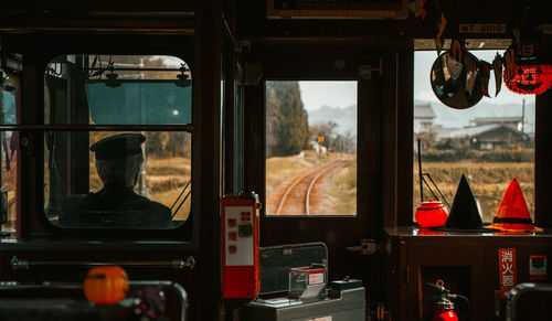 Rear view of man driving train