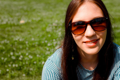 Portrait of young woman wearing sunglasses