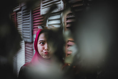 Portrait of young woman looking away