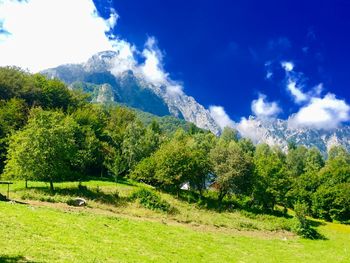 Scenic view of mountains against cloudy sky