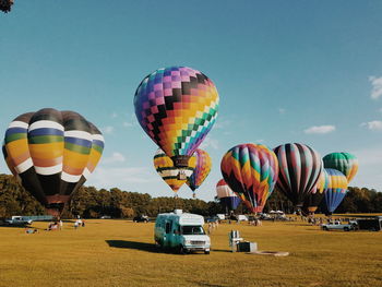 Hot air balloons flying against clear sky