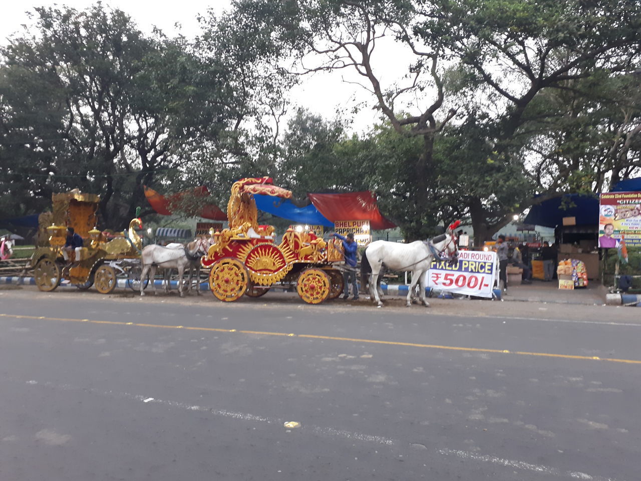 PEOPLE ON ROAD AGAINST SKY