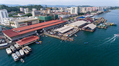 High angle view of cityscape by sea