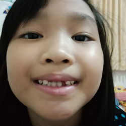 Close-up portrait of smiling girl