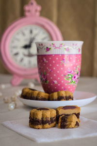 Close-up of cookies in glass on table