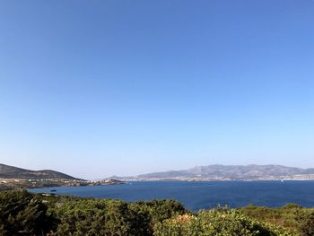 Scenic view of sea against clear blue sky