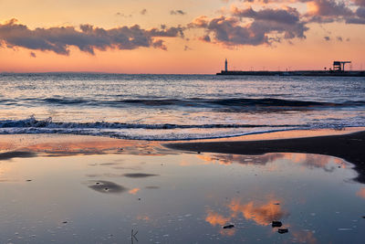 Scenic view of sea against sky during sunset