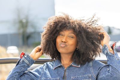 Portrait of smiling young woman looking away