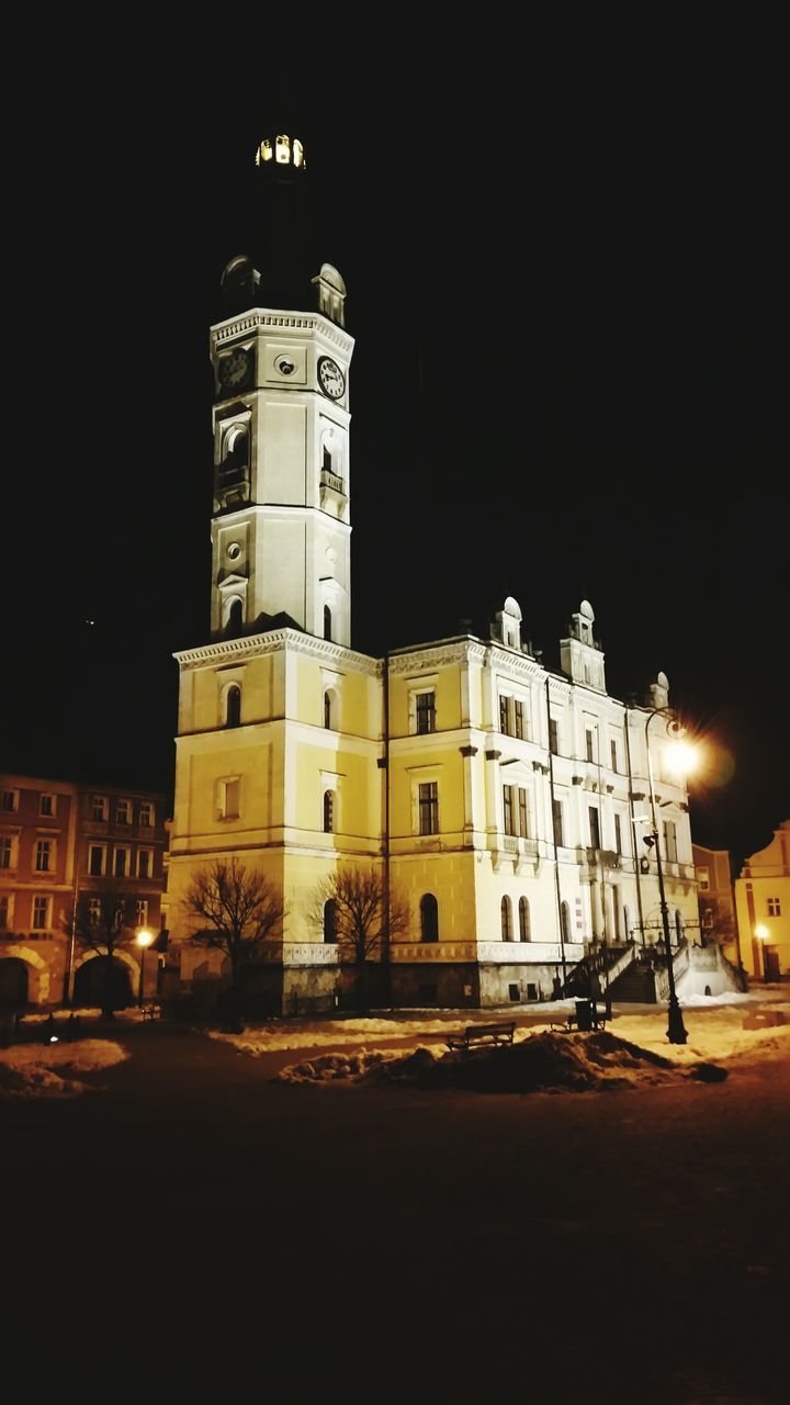 building exterior, architecture, night, built structure, illuminated, city, transportation, clear sky, street, car, road, land vehicle, travel, travel destinations, copy space, street light, history, famous place, city street, mode of transport