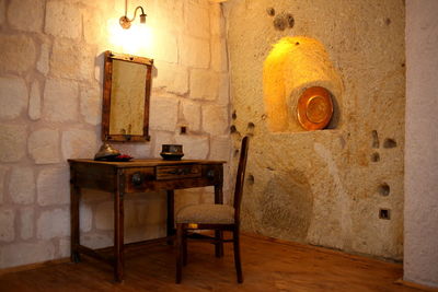 Table and chairs against wall at home