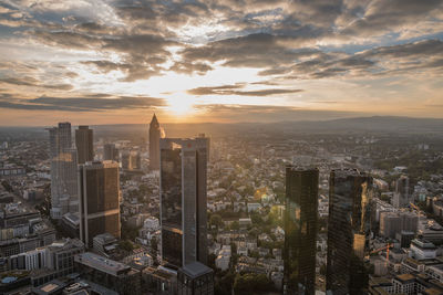 Cityscape against sky during sunset