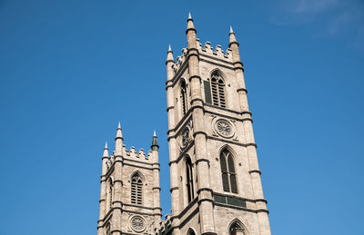 Low angle view of clock tower against sky