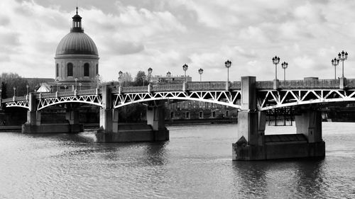 Bridge over river against sky